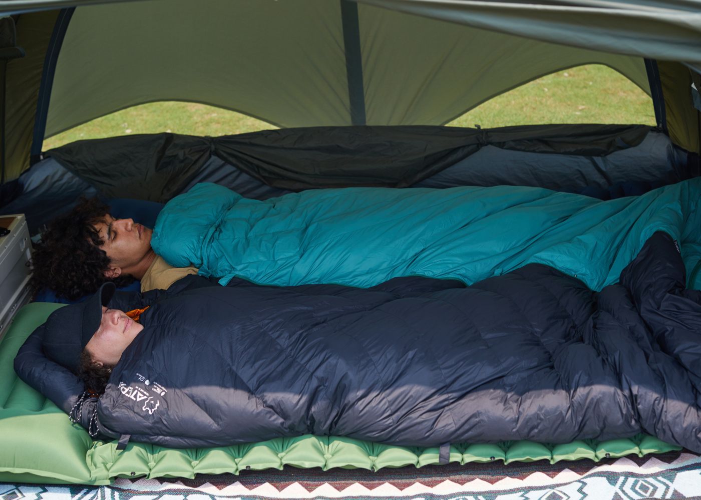  Down sleeping bag set up inside tent for warm overnight camping experience