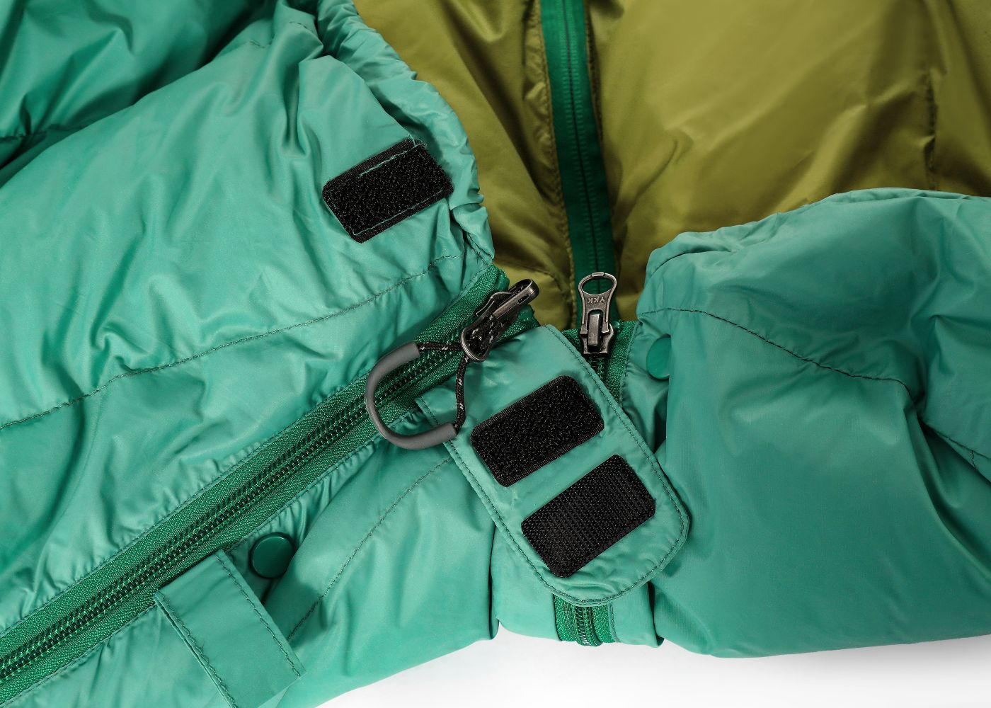Close-up view of reinforced stitching and double zipper for durability in ultralight sleeping bag