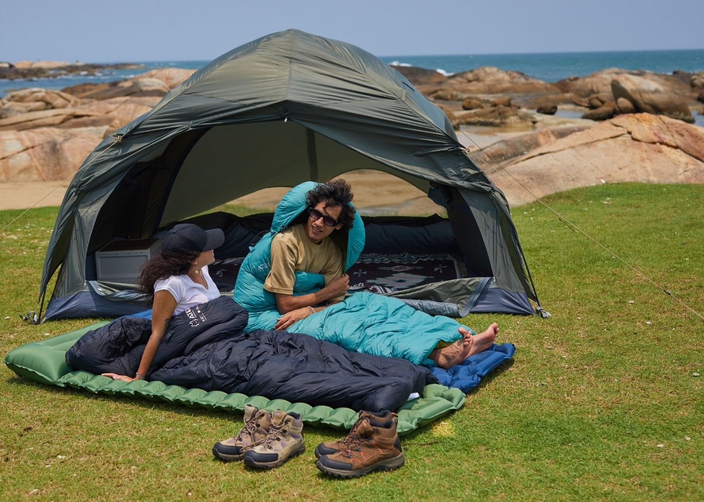 Down sleeping bag set up inside tent for warm overnight camping experience