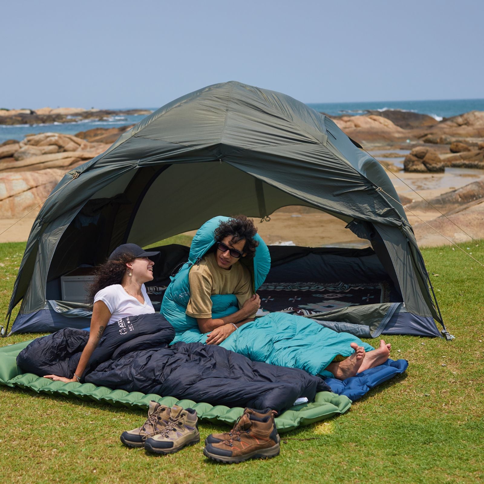 Ultralight sleeping bag in black keeping camper warm during cold-weather camping nights