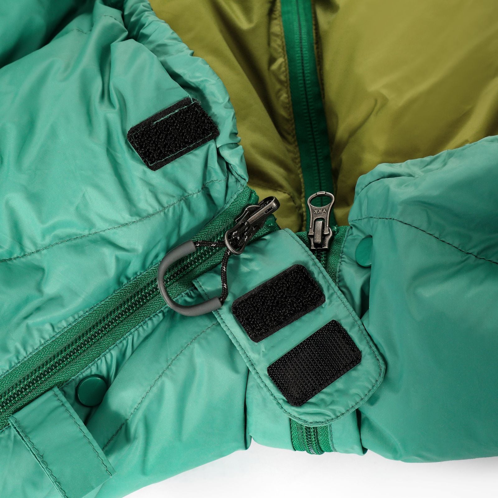 Close-up view of reinforced stitching and double zipper for durability in ultralight sleeping bag