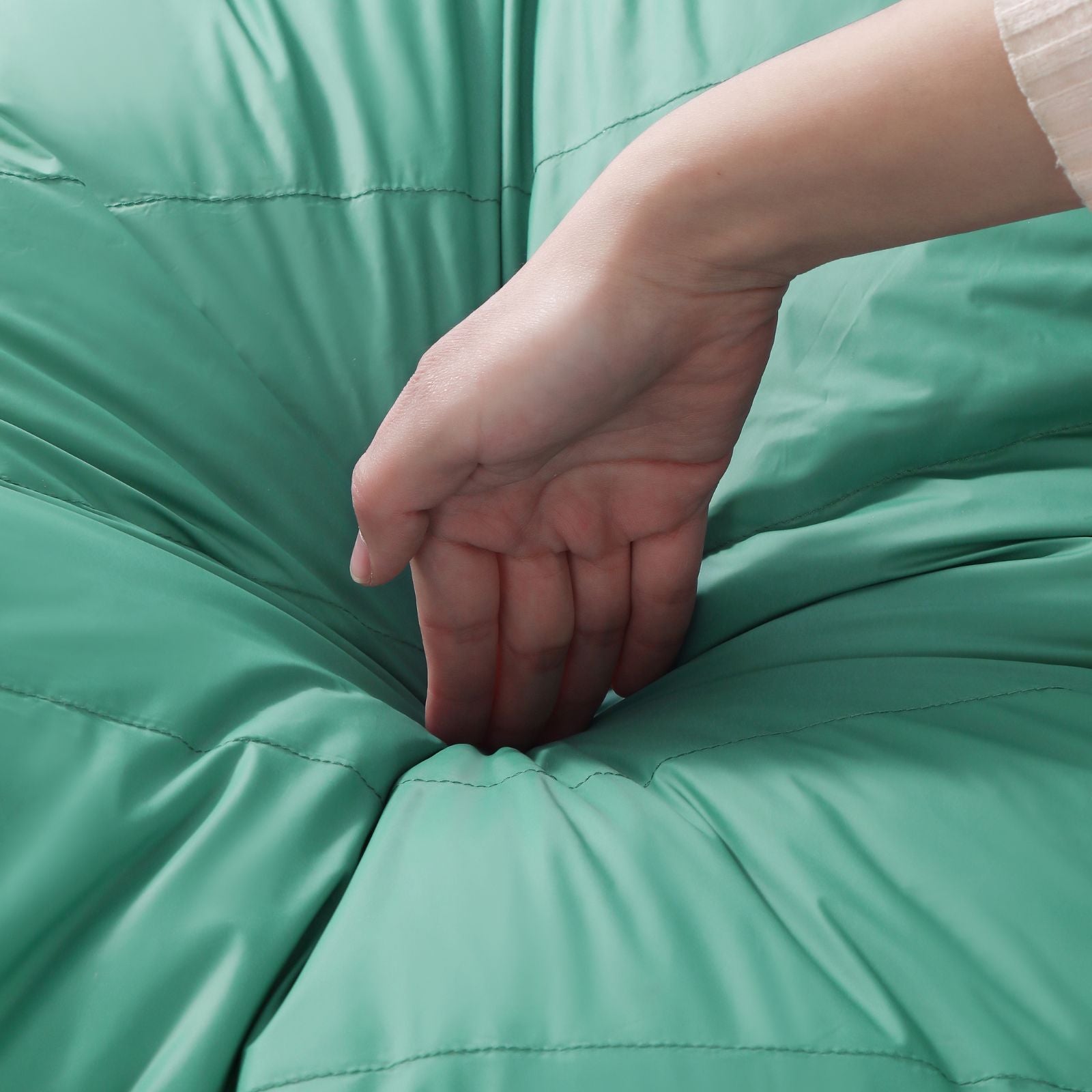  Lightweight and soft material of down sleeping bag shown in close-up view