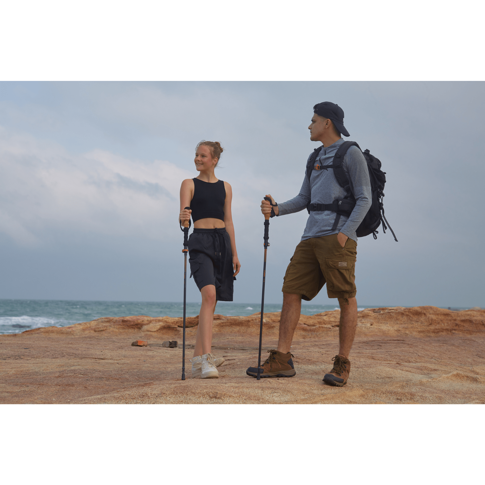 Trekker using Unitymarts trekking poles on rocky trail for balance and stability