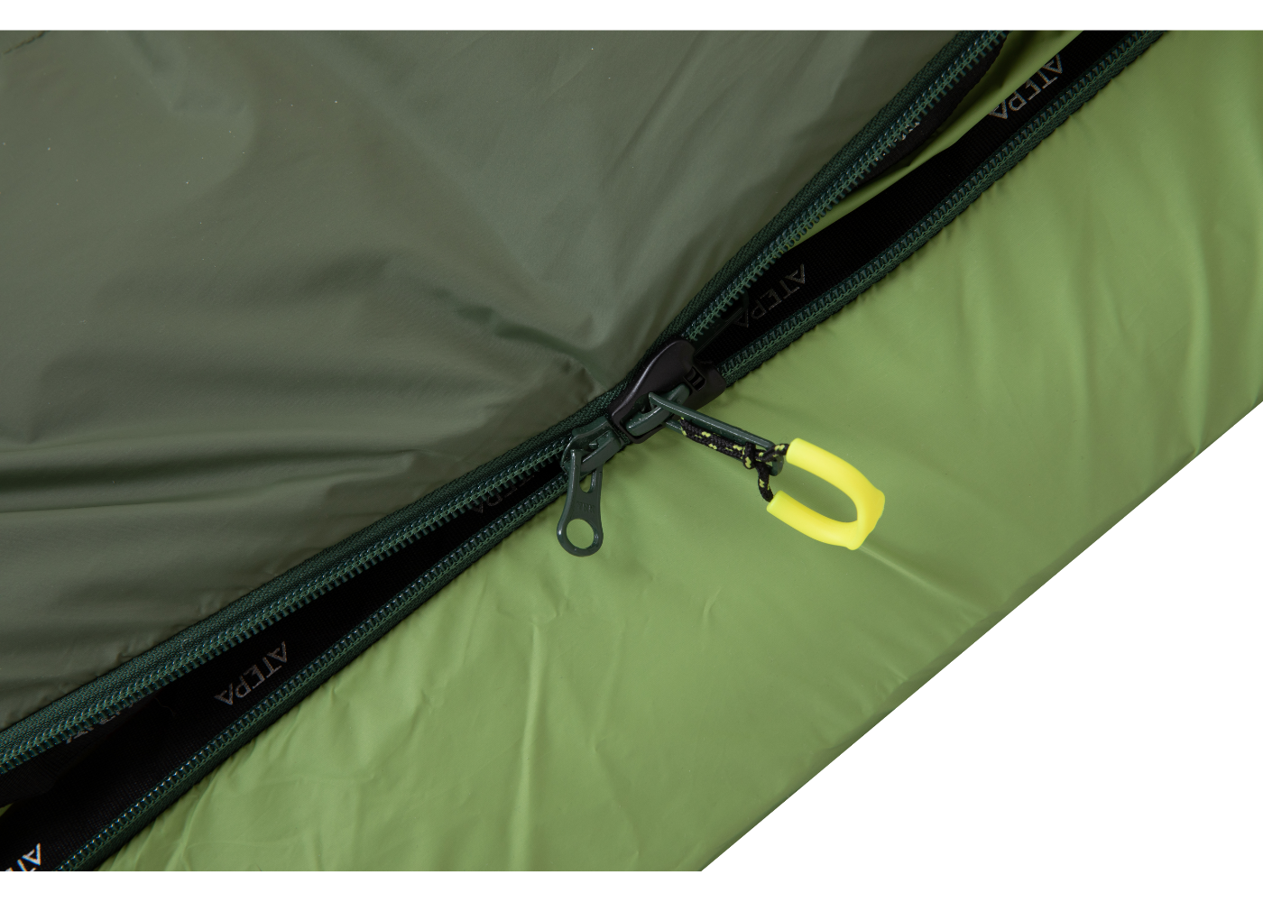 Close-up of Green sleeping bag double zipper and precise stitching
