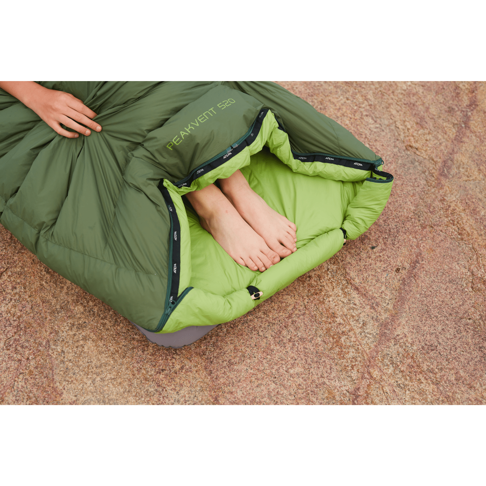 Close-up of blue sleeping bag double zipper and precise stitching