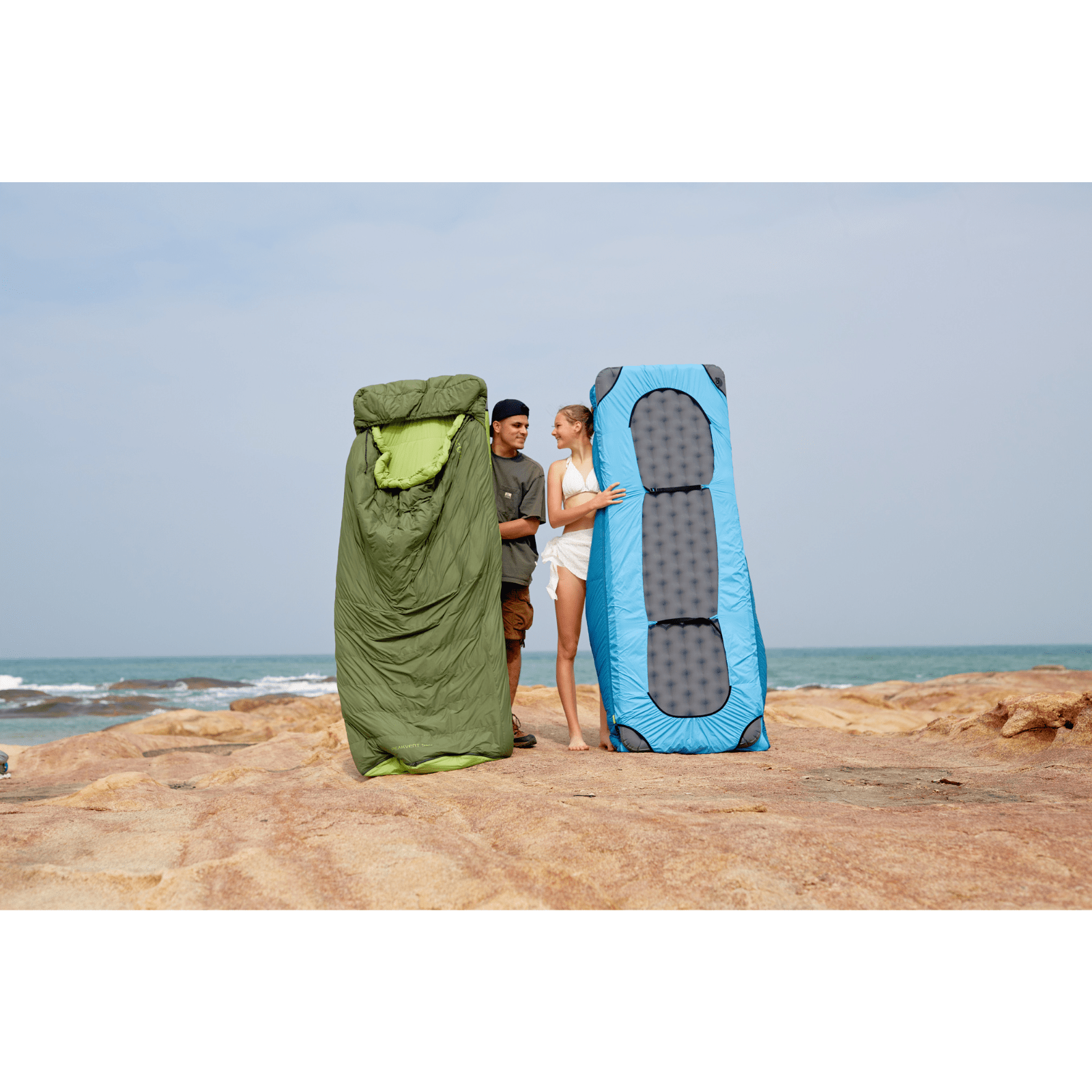 Camper relaxing in blue lightweight down sleeping bag for comfort and warmth