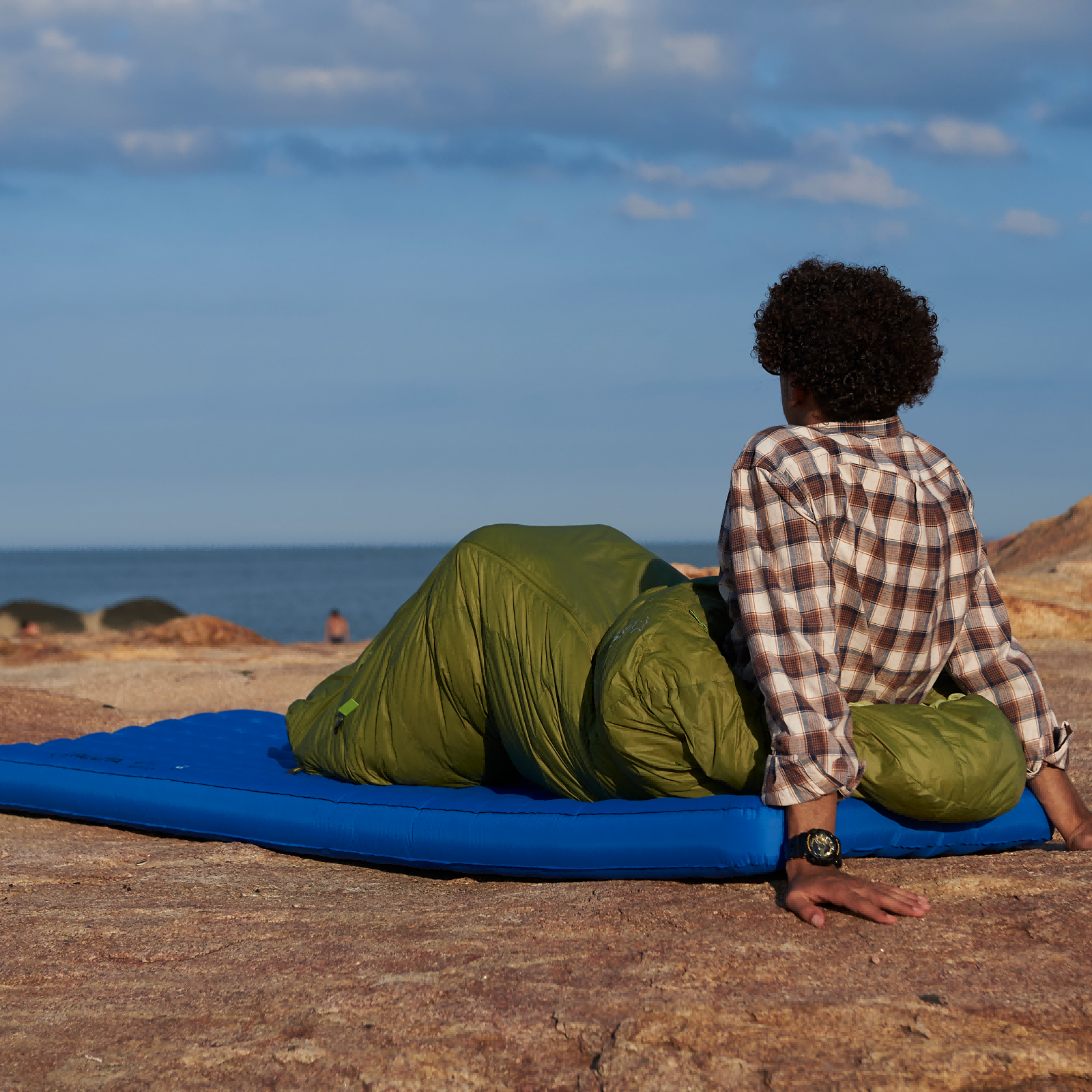 Ultralight sleeping pad fully inflated on outdoor grass ready for backpacking